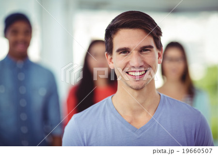 Young creative team smiling at camera Young creative team smiling at camera 19660507