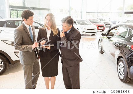 Sales team look at a clipboard 19661348