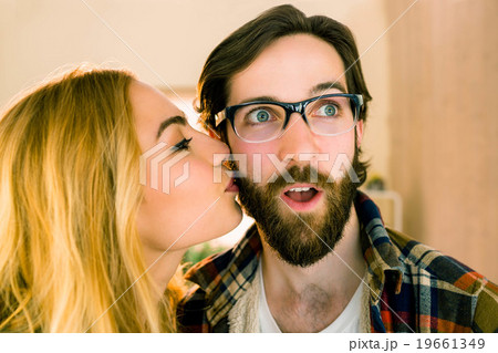 Pretty blonde kissing her co worker Pretty blonde kissing her co worker 19661349