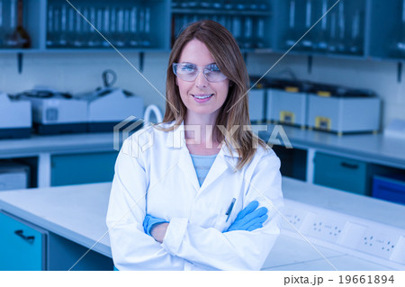 Scientist smiling at the camera in lab Scientist smiling at the camera in lab 19661894