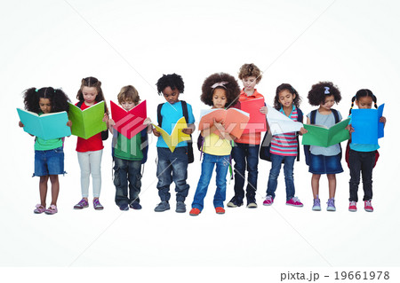 A row of children standing together reading books A row of children standing together reading books 19661978