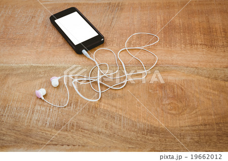 Black smartphone with white headphones 19662012