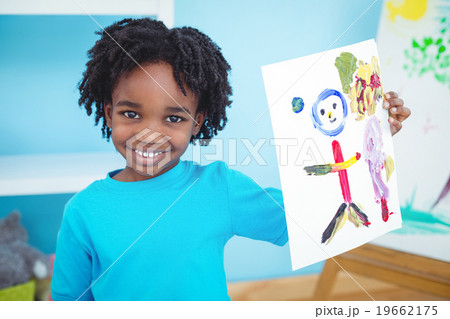 Happy kid enjoying arts and crafts painting Happy kid enjoying arts and crafts painting 19662175