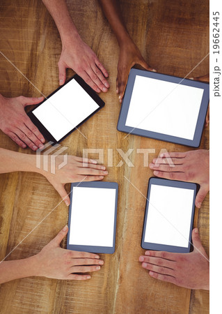 Creative team working together on a tablet and smartphones Creative team working together on a tablet and smartphones 19662445