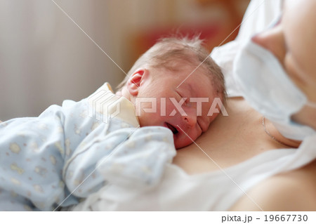 One day old newborn baby with mother One day old newborn baby with mother 19667730