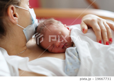 One day old newborn baby with mother One day old newborn baby with mother 19667731