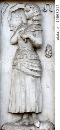 bas-relief with woman holding the umbel bas-relief with woman holding the umbel 19668012