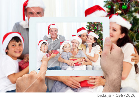 Composite image of hand holding tablet pc 19672626