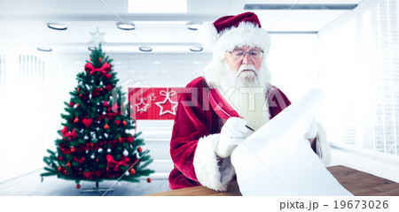 Composite image of santa writes something with a feather Composite image of santa writes something with a feather 19673026