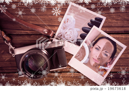 Composite image of peaceful brunette getting a mud facial applie Composite image of peaceful brunette getting a mud facial applie 19673618