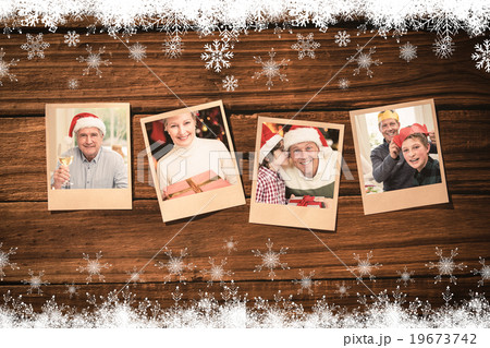 Composite image of instant photos on wooden floor 19673742