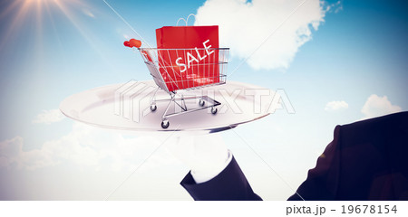 Composite image of hand with white gloves holding a silver tray 19678154