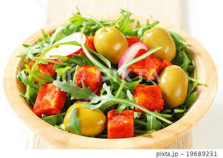 Salad greens with olives and spicy cheese 19689231
