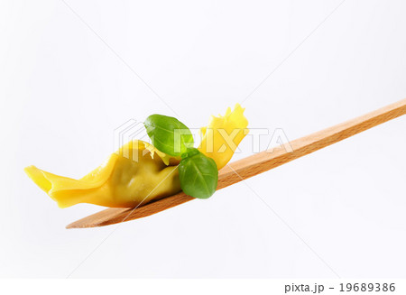 Stuffed pasta on wooden spatula 19689386