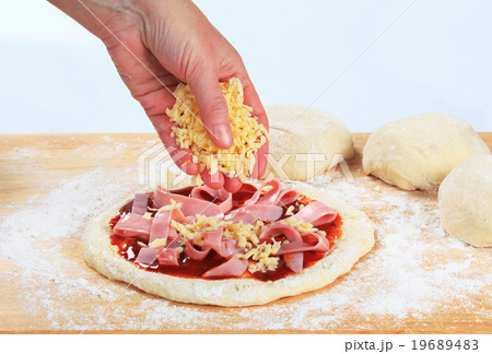 Cook preparing pizza 19689483