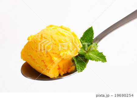 Yellow ice cream on spoon Yellow ice cream on spoon 19690254