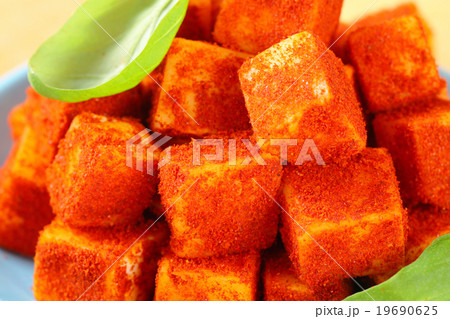 Diced cheese rolled in paprika Diced cheese rolled in paprika 19690625