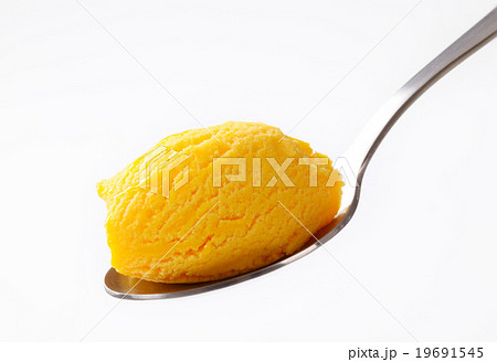 Yellow ice cream on spoon 19691545