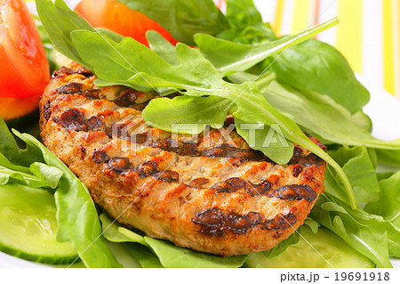 Grilled patty with rocket and cucumber salad Grilled patty with rocket and cucumber salad 19691918