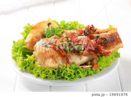Pan fried fish fillets with bacon bits 19691976