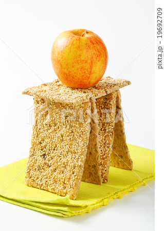 Sesame seed crackers and fresh apple Sesame seed crackers and fresh apple 19692709