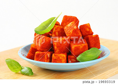 Diced cheese rolled in paprika Diced cheese rolled in paprika 19693319