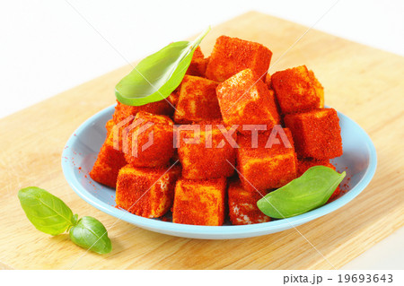 Diced cheese rolled in paprika Diced cheese rolled in paprika 19693643
