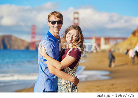 Romantic loving couple having a date on Baker beach in San Francisco Romantic loving couple having a date on Baker beach in San Francisco 19697778