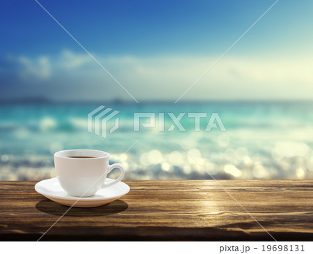 sea and cup of coffee sea and cup of coffee 19698131