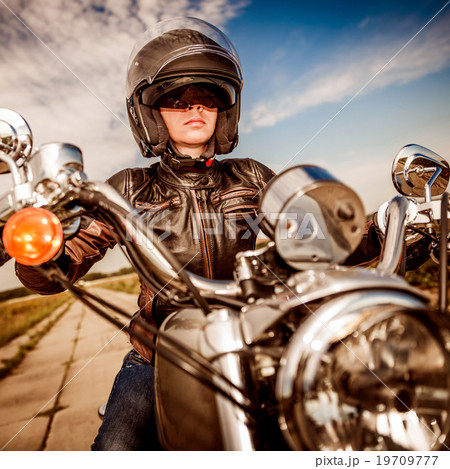 Biker girl on a motorcycle 19709777