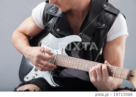 Skillful young guitarist is making great 19715086