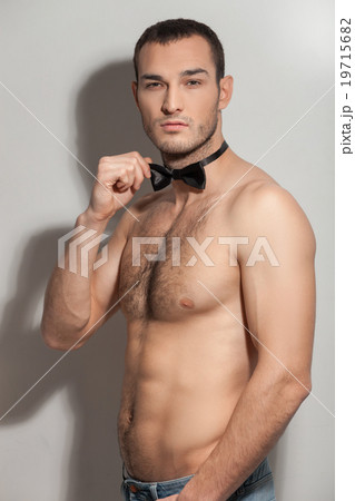 Attractive fit guy is showing his bared body 19715682