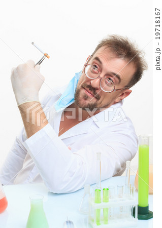 Crazy chemist smokes a cigarette Crazy chemist smokes a cigarette 19718167