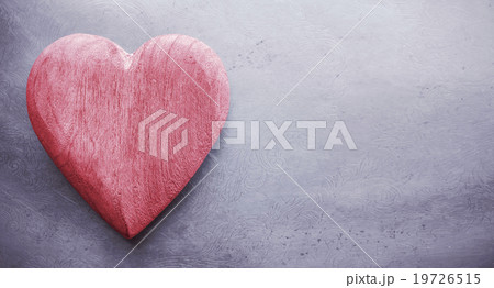 Vintage toned wooden heart on grunge background. 19726515