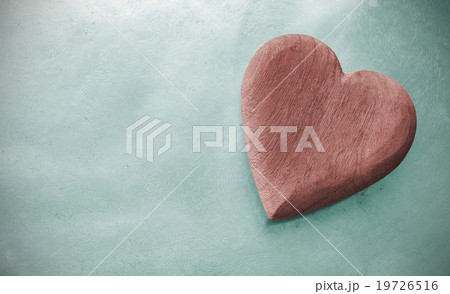Vintage toned wooden heart on grunge background. 19726516