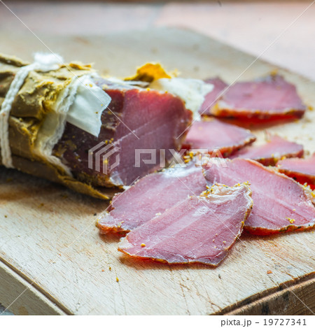 smoked wild boar meat on the wooden board 19727341