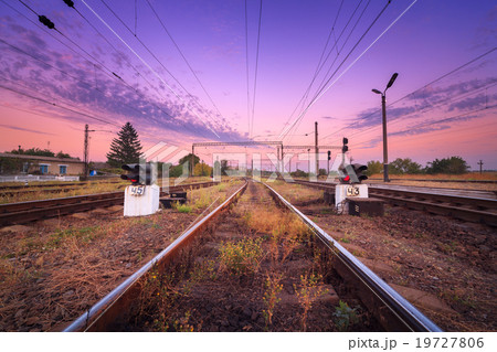 Railway station and traffic light  at sunset 19727806