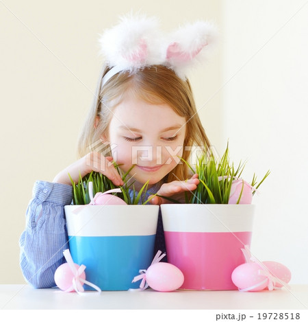 Adorable little girl wearing bunny ears on Easter Adorable little girl wearing bunny ears on Easter 19728518