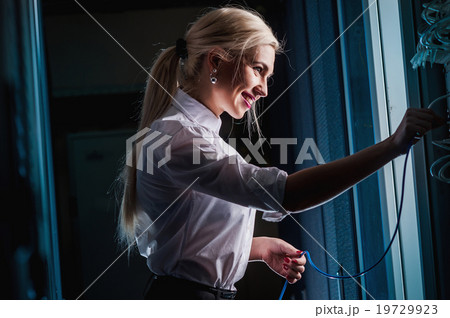 Young engineer businesswoman in server room Young engineer businesswoman in server room 19729923