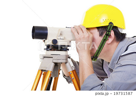 Surveyor worker making measurement and isolated on white Surveyor worker making measurement and isolated on white 19731587