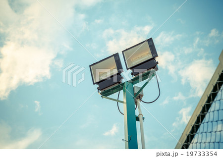 stadium lights under blue sky with pastel tone 19733354
