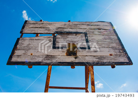 Basketball hoop is broken and wood board damaged Basketball hoop is broken and wood board damaged 19743493