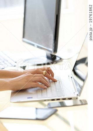Hands typing on laptop keyboard Hands typing on laptop keyboard 19761862