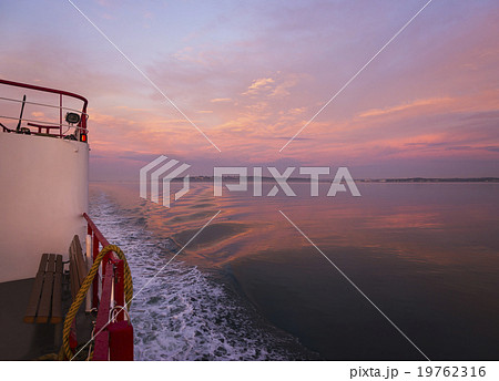 View from ferry towards sea at sunrise 19762316