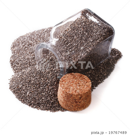 Carefully selected Chia seeds spill out of a jar Carefully selected Chia seeds spill out of a jar 19767489
