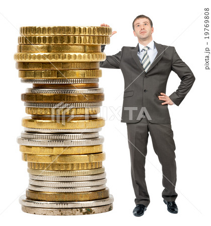 Businessman with big stack of coins Businessman with big stack of coins 19769808