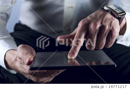 Man working on digital tablet 19771217