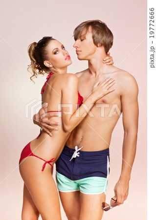 Beautiful couple in swimsuits Beautiful couple in swimsuits 19772666
