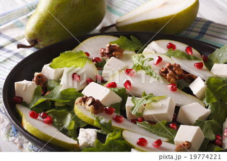Pear salad with pomegranate, cheese, walnuts Pear salad with pomegranate, cheese, walnuts 19774221