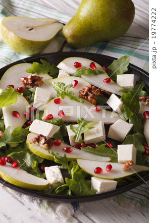Pear salad with pomegranate, cheese and arugula 19774222